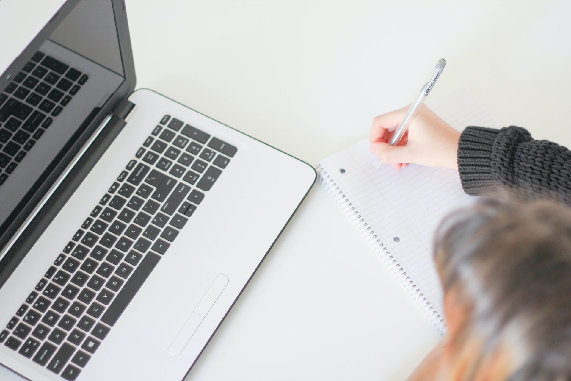 Woman writing on a notepad